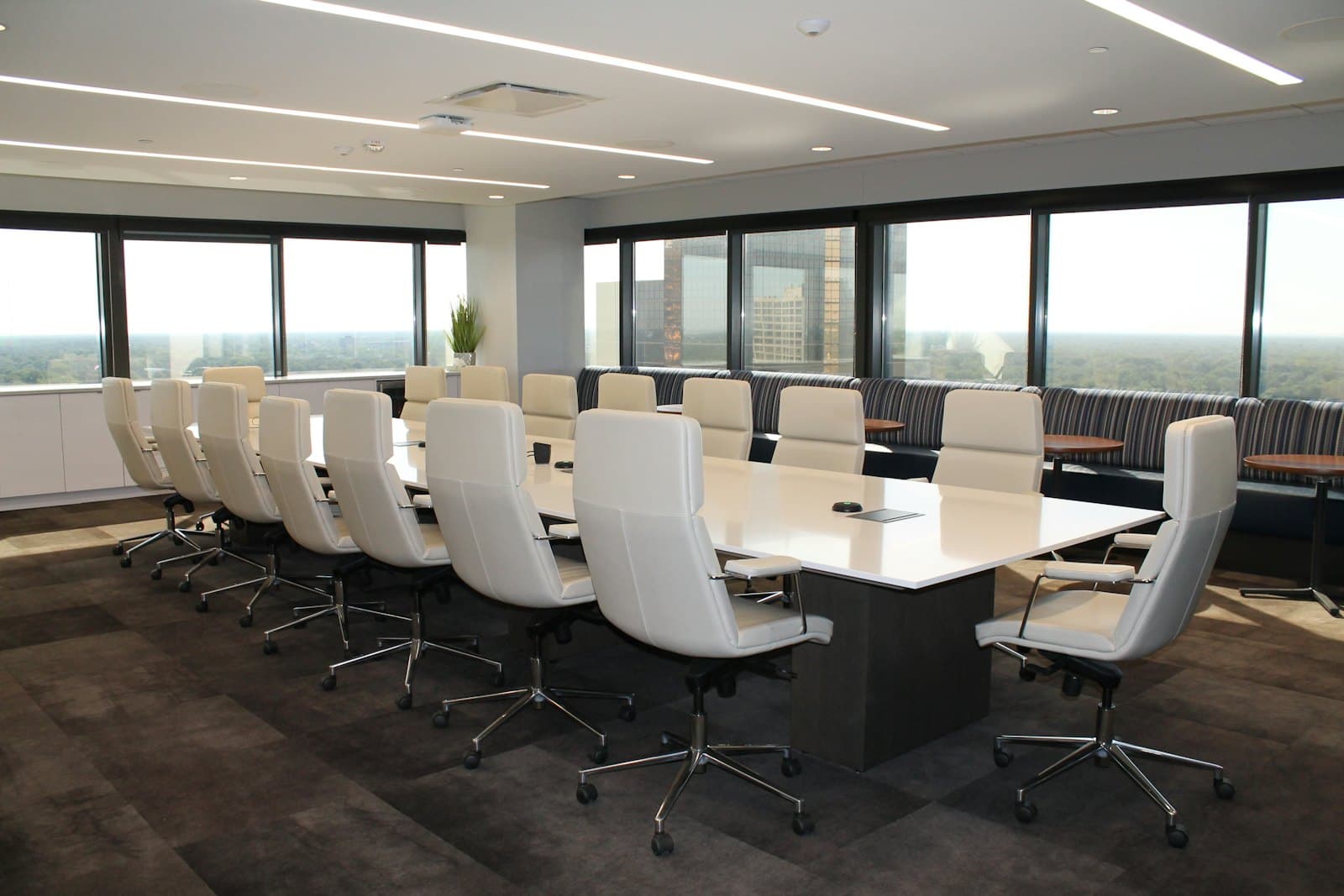 Boardroom with long table and city views