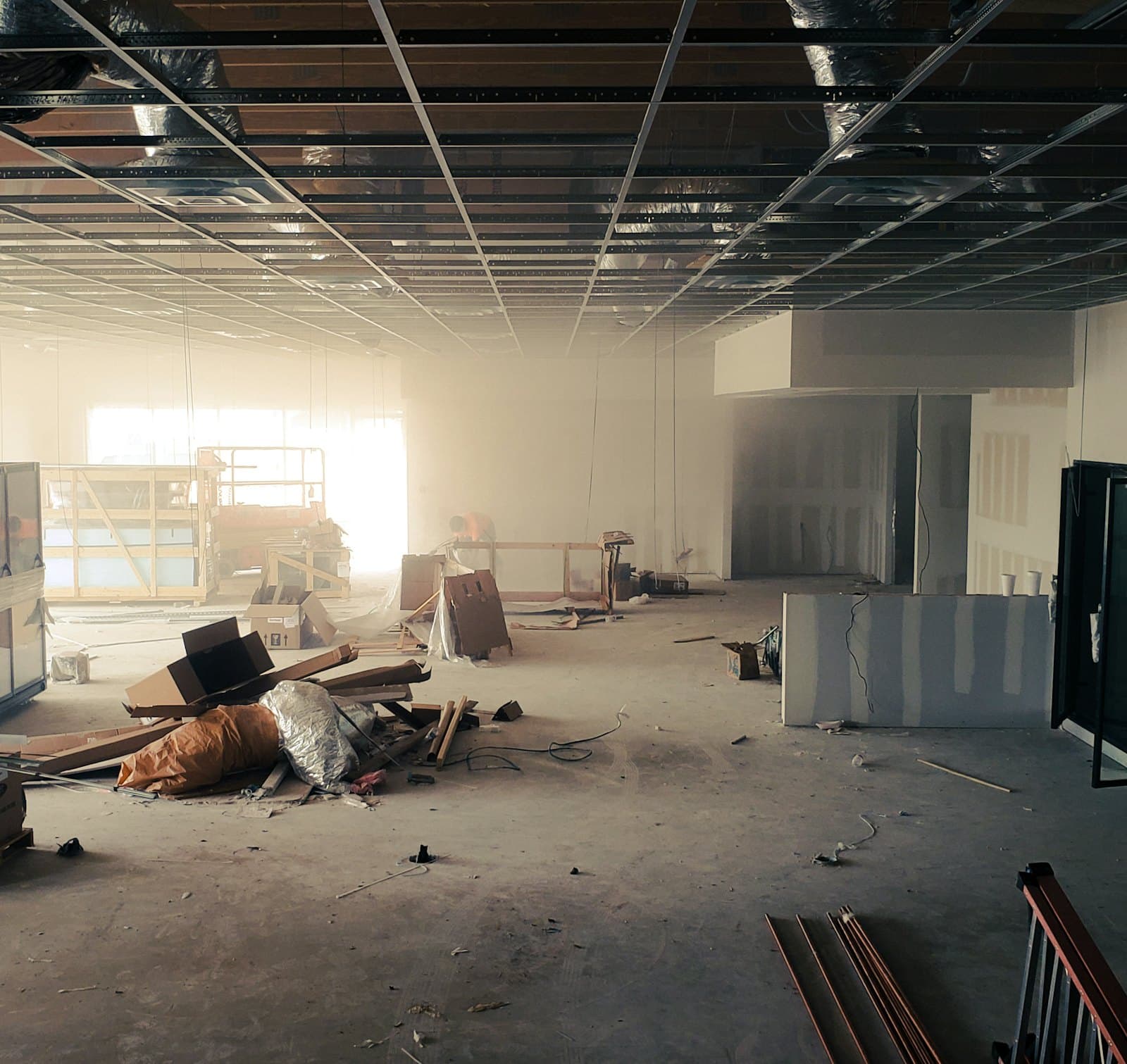 Interior space under renovation with dust and building materials