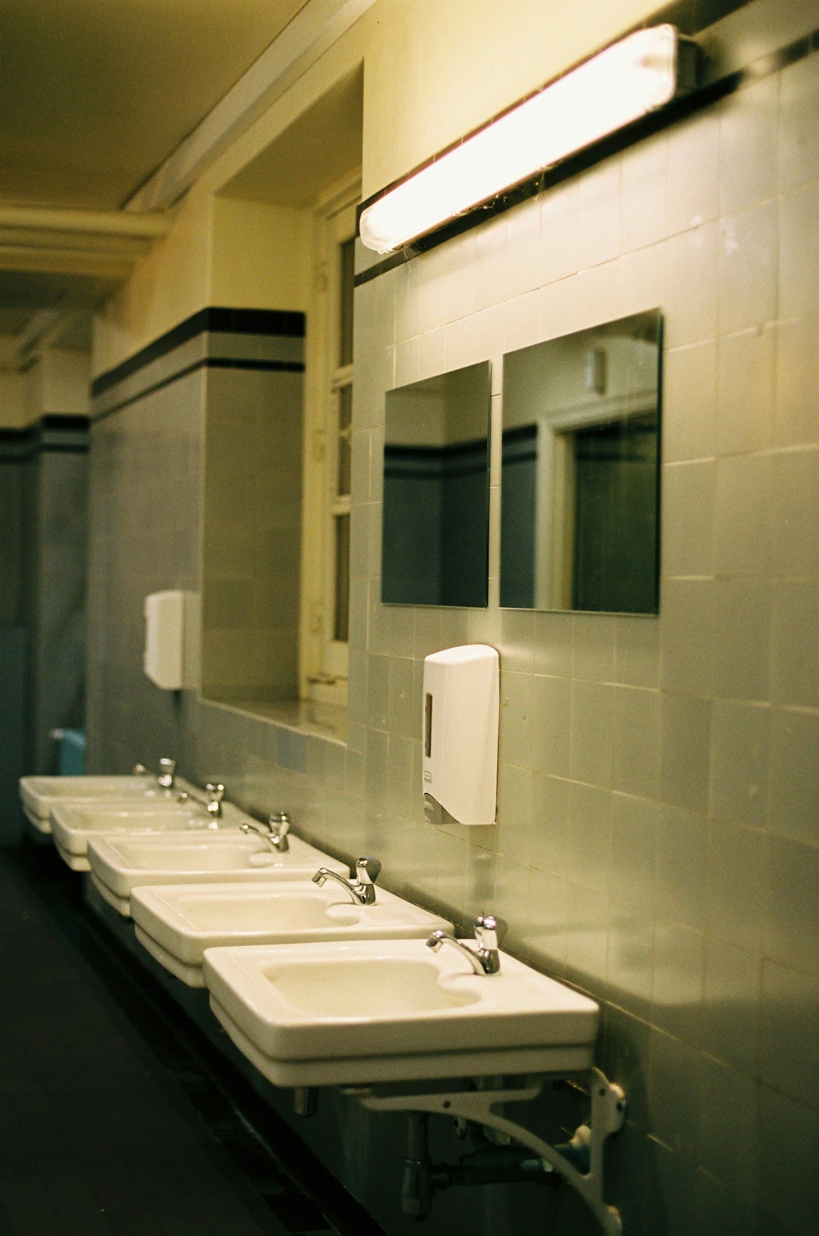 Modern office washroom with basins